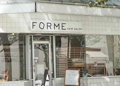 Exterior of Forme Hair Salon & Head Spa in Vancouver, British Columbia, CA, showcasing modern window display.