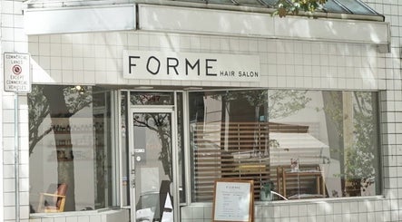 Exterior of Forme Hair Salon & Head Spa in Vancouver, British Columbia, CA, showcasing modern window display.