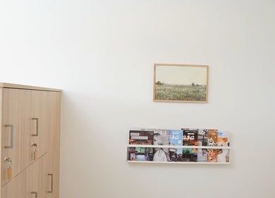 Serene waiting area at Forme Hair Salon & Head Spa, Vancouver, BC, with magazines and minimalist decor.
