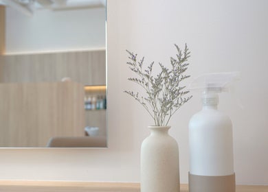 Elegant vase and spray bottle in Forme Hair Salon & Head Spa, Vancouver, British Columbia, CA.
