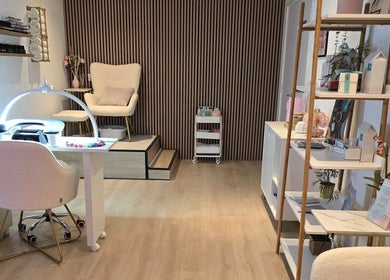Tranquil interior of Naked Glow Clinic in Hartland, England, GB with plush chairs and elegant decor.