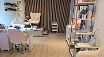 Tranquil interior of Naked Glow Clinic in Hartland, England, GB with plush chairs and elegant decor.