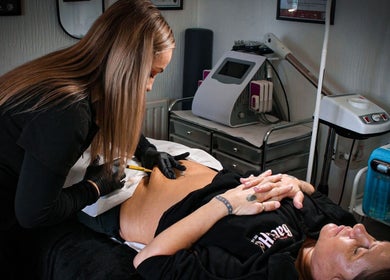Professional treatment at Naked Glow Clinic in Hartland, England, GB, enhancing beauty and wellness.