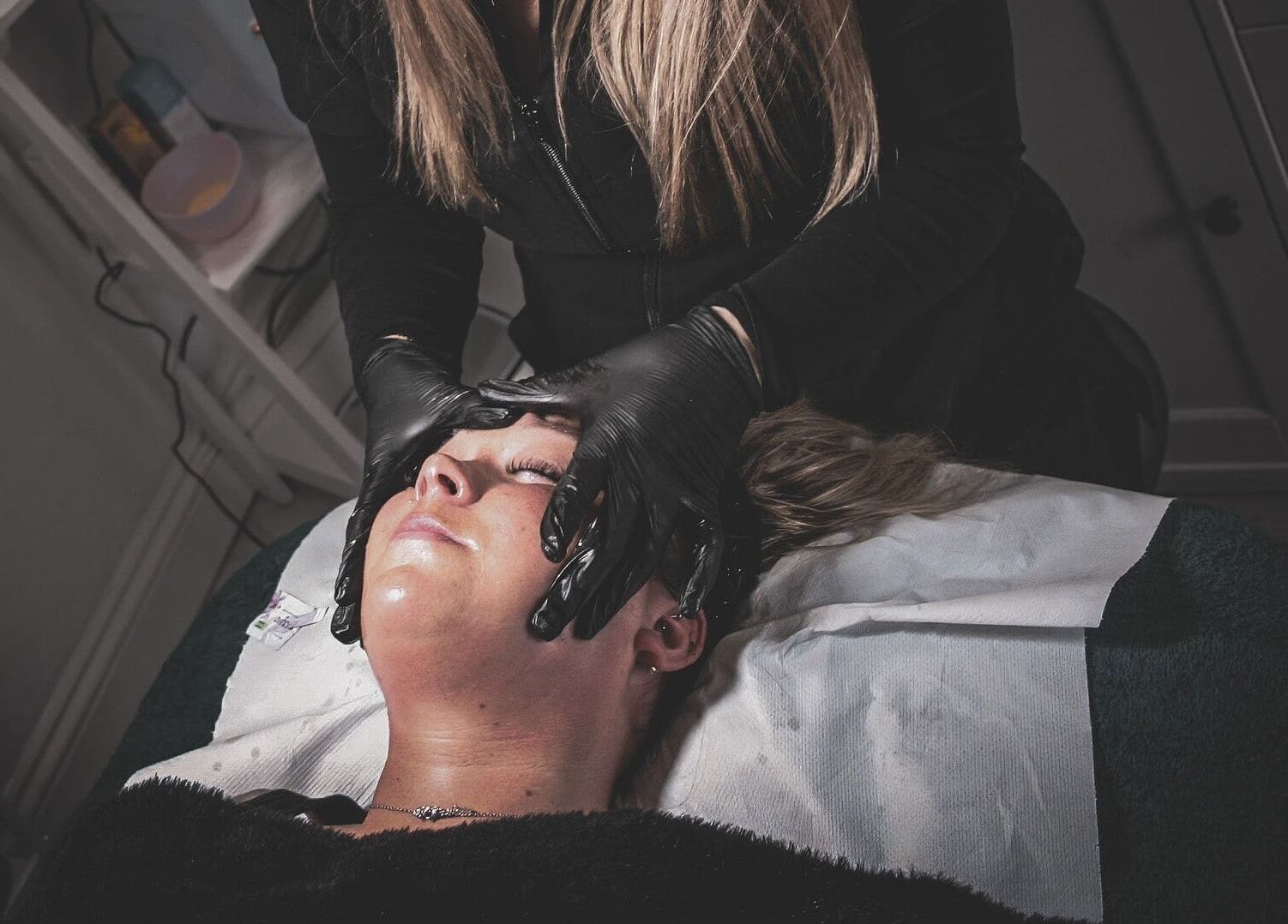 Relaxing facial massage at Naked Glow Clinic, Hartland, England, GB.