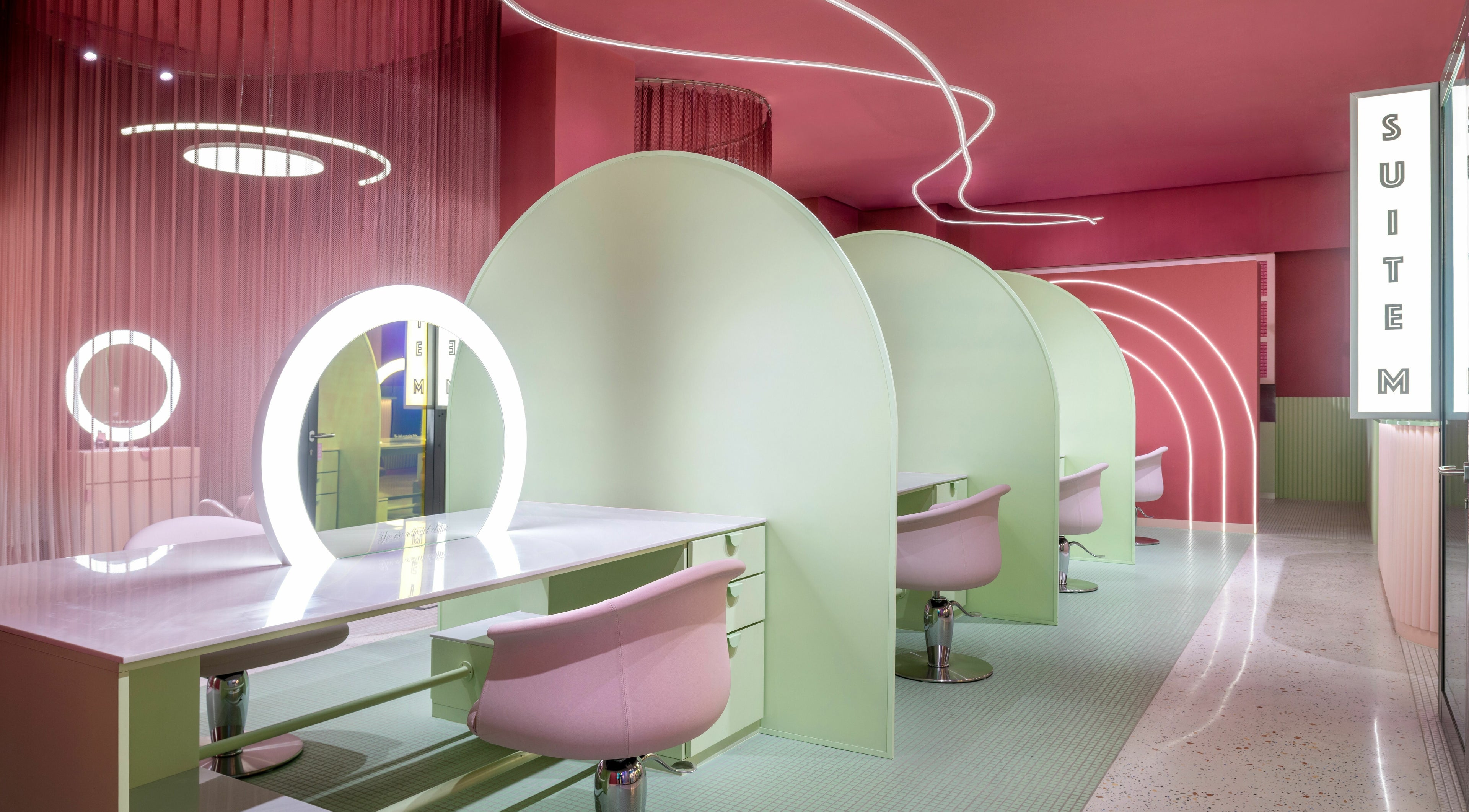 Modern beauty stations at MKP Ladies Salon, Dubai, Dubai, AE with stylish pink and green decor.