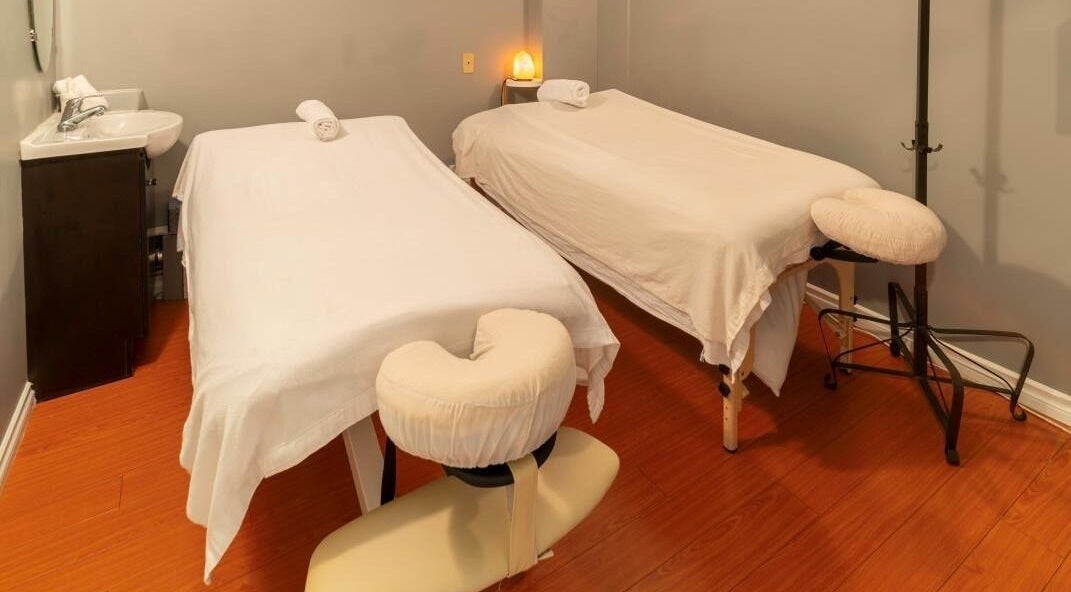 Relaxing massage room at Comfy Spa, Vancouver, British Columbia, CA, featuring two massage tables.