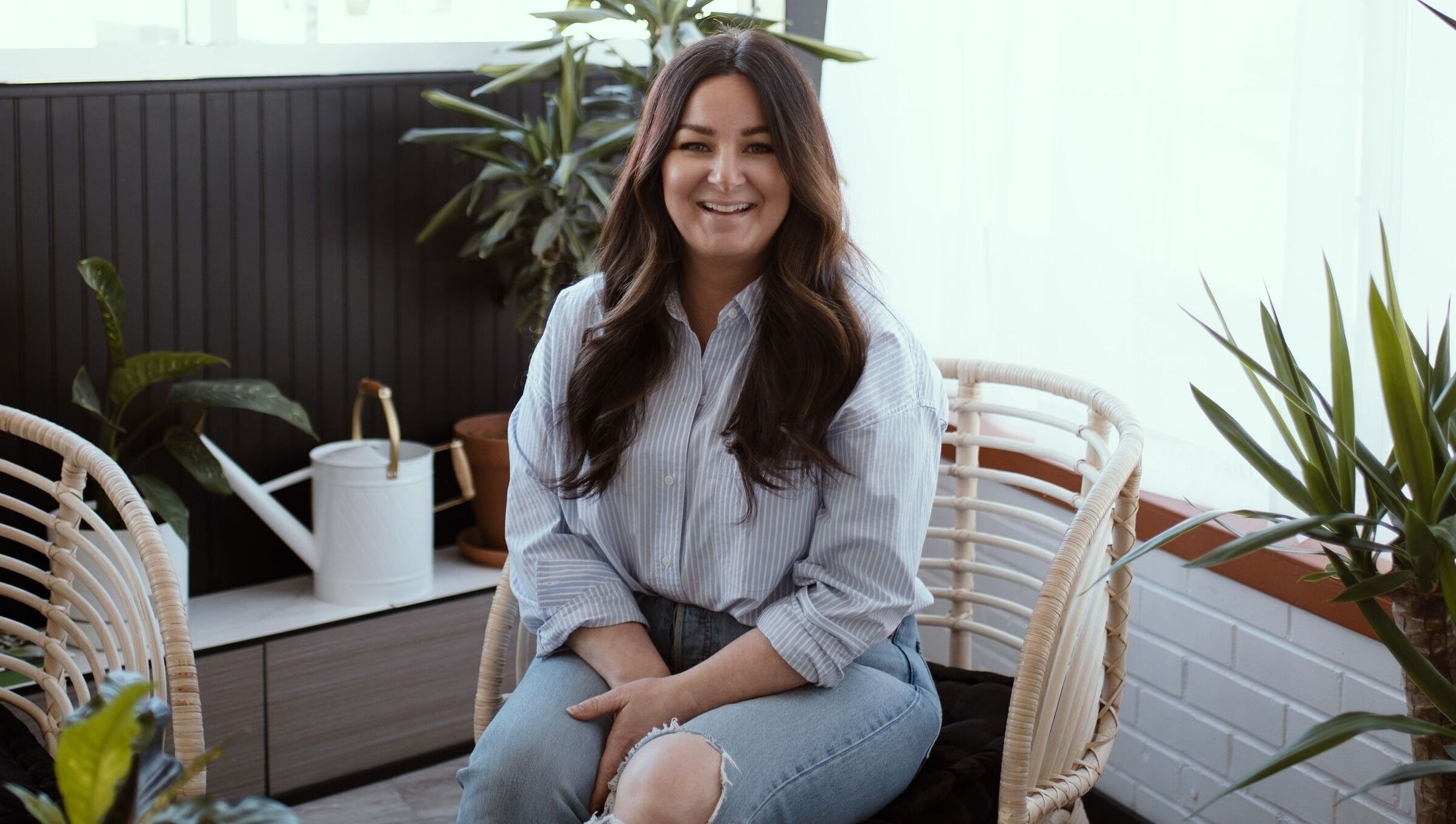 Relaxing atmosphere at Brows & Skin by Julie B in Medicine Hat, Alberta, CA, featuring cozy seating and green plants.