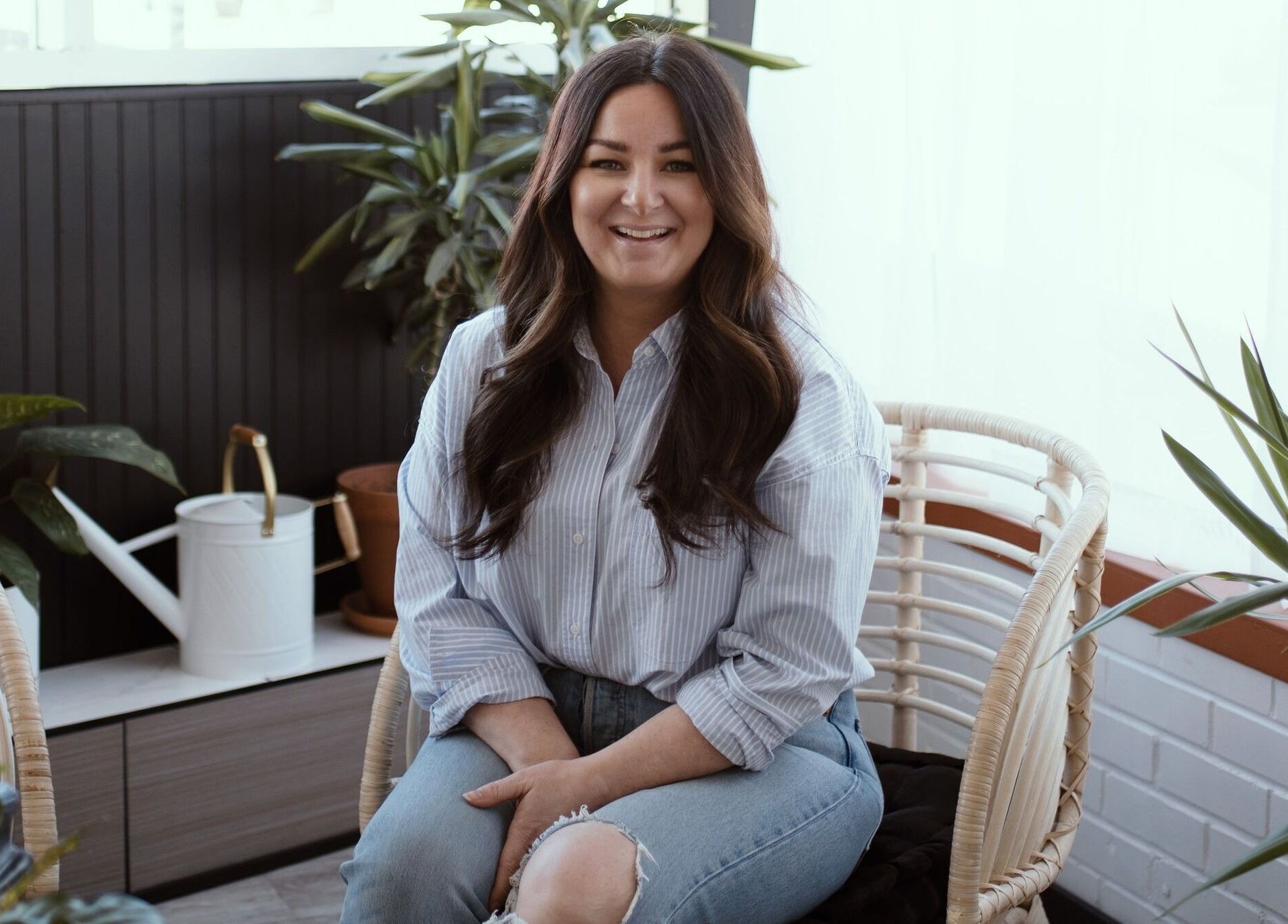 Relaxing atmosphere at Brows & Skin by Julie B in Medicine Hat, Alberta, CA, featuring cozy seating and green plants.
