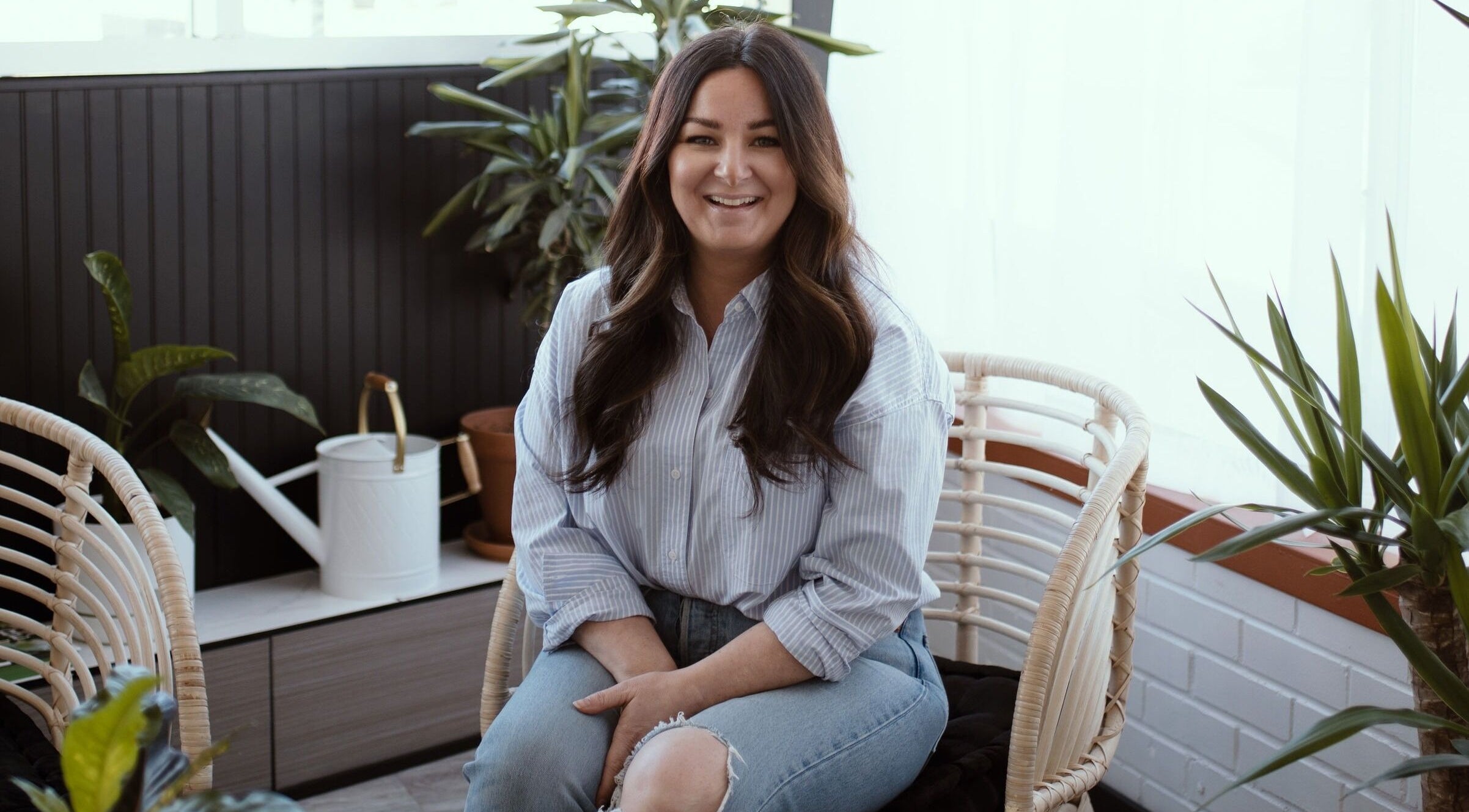 Relaxing atmosphere at Brows & Skin by Julie B in Medicine Hat, Alberta, CA, featuring cozy seating and green plants.