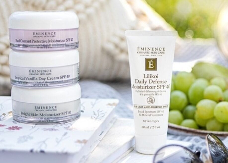 Skincare products at Brows & Skin by Julie B, Medicine Hat, Alberta, CA with fresh grapes and serene setting.