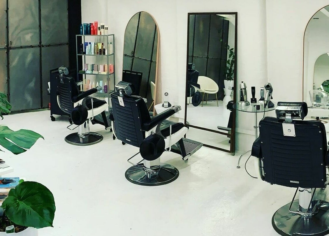 Modern salon chairs and mirrors at Worksense Haircutters, Melbourne, VIC, AU.
