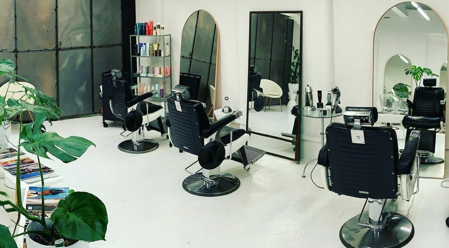 Modern salon chairs and mirrors at Worksense Haircutters, Melbourne, VIC, AU.
