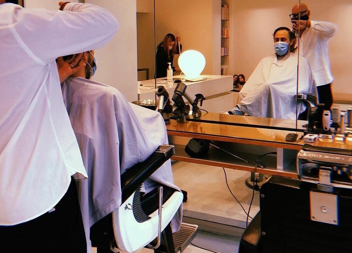 Stylish haircut in progress at Worksense Haircutters, Melbourne, VIC, AU. Sophisticated interior with mirror.