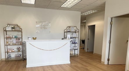 Reception area of Vitality Spa and Lounge, Bloomsburg, Pennsylvania, US, with elegant shelving and decor.