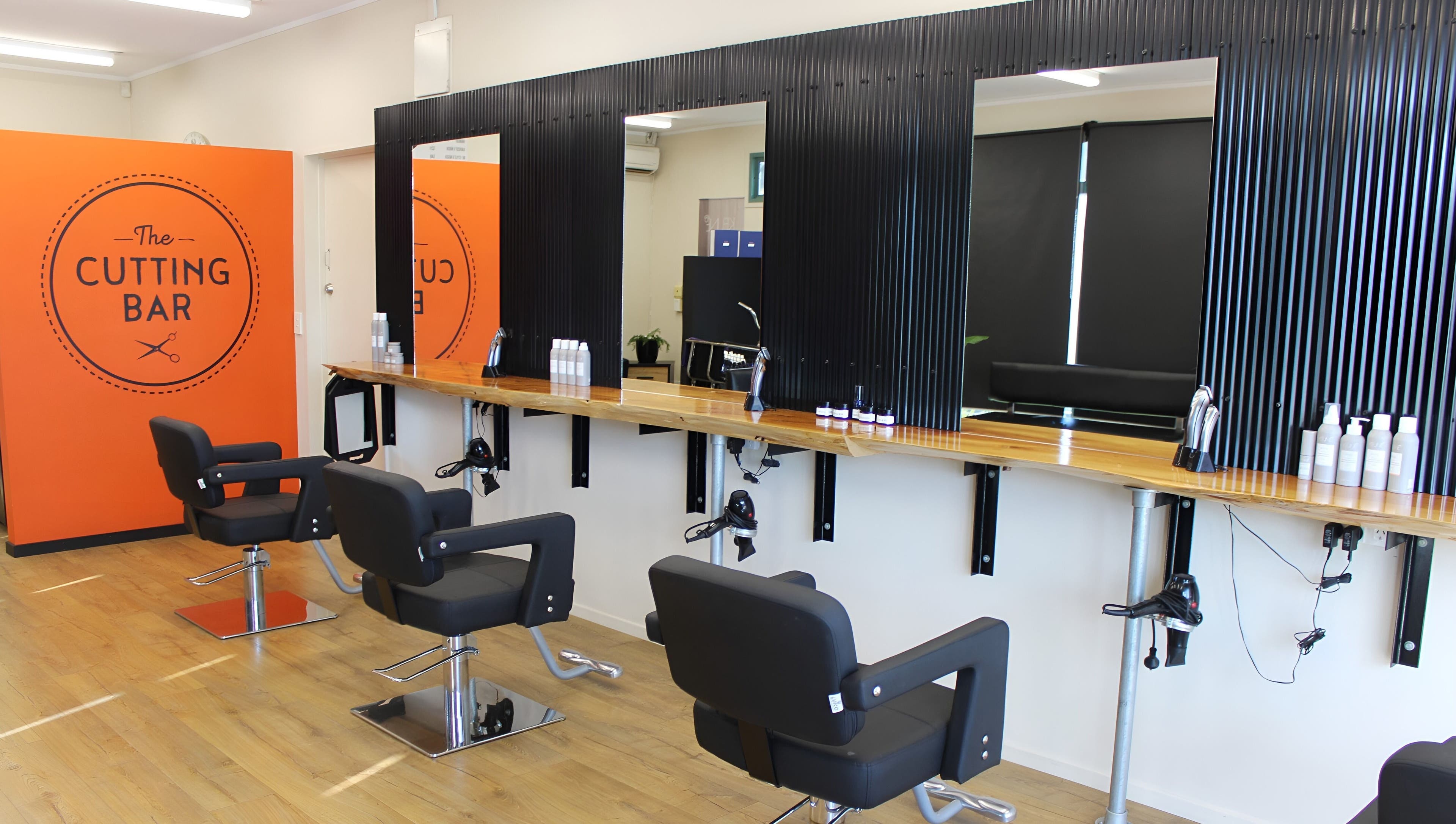 Modern salon chairs and mirrors at The Cutting Bar, Nelson, Nelson, NZ.
