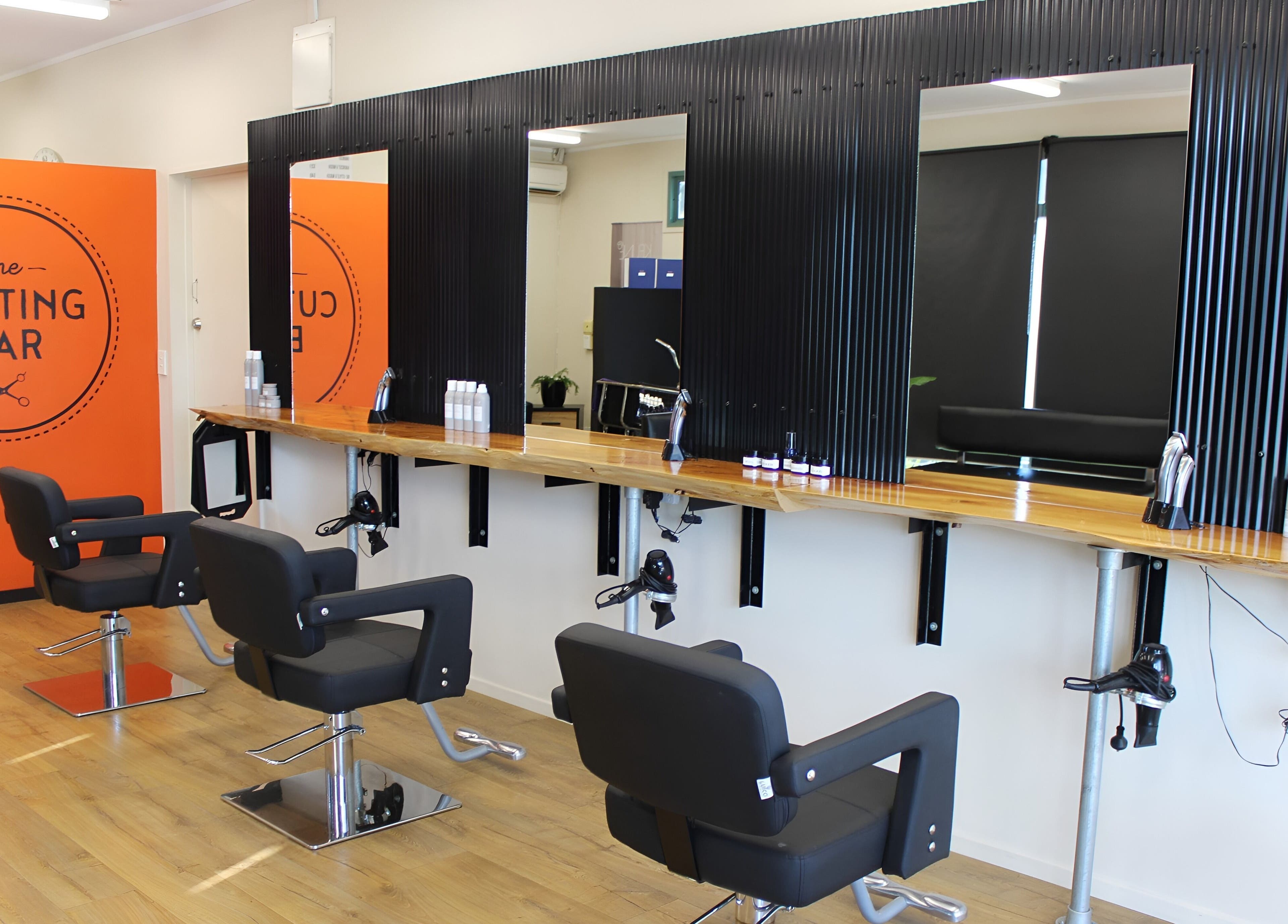 Modern salon chairs and mirrors at The Cutting Bar, Nelson, Nelson, NZ.