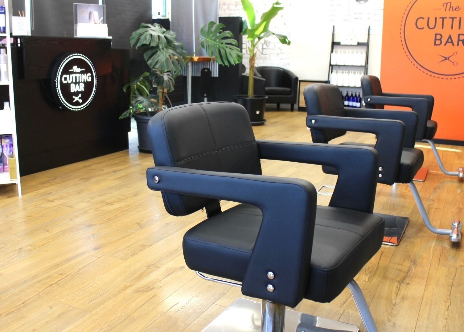 Modern salon chairs at The Cutting Bar, Nelson, Nelson, NZ, offering a sleek and comfortable experience.