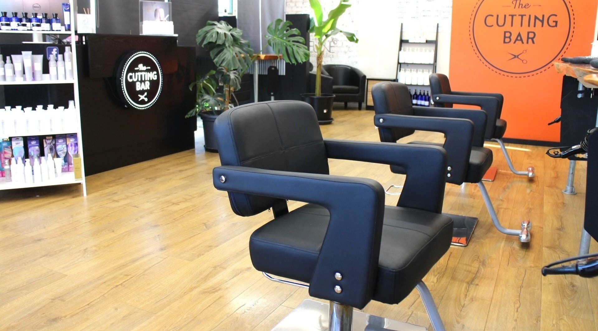 Modern salon chairs at The Cutting Bar, Nelson, Nelson, NZ, offering a sleek and comfortable experience.