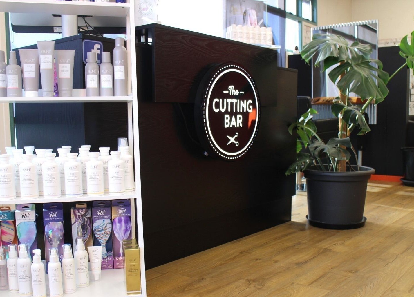 Inside The Cutting Bar, Nelson, NZ, featuring stylish product display and modern decor.
