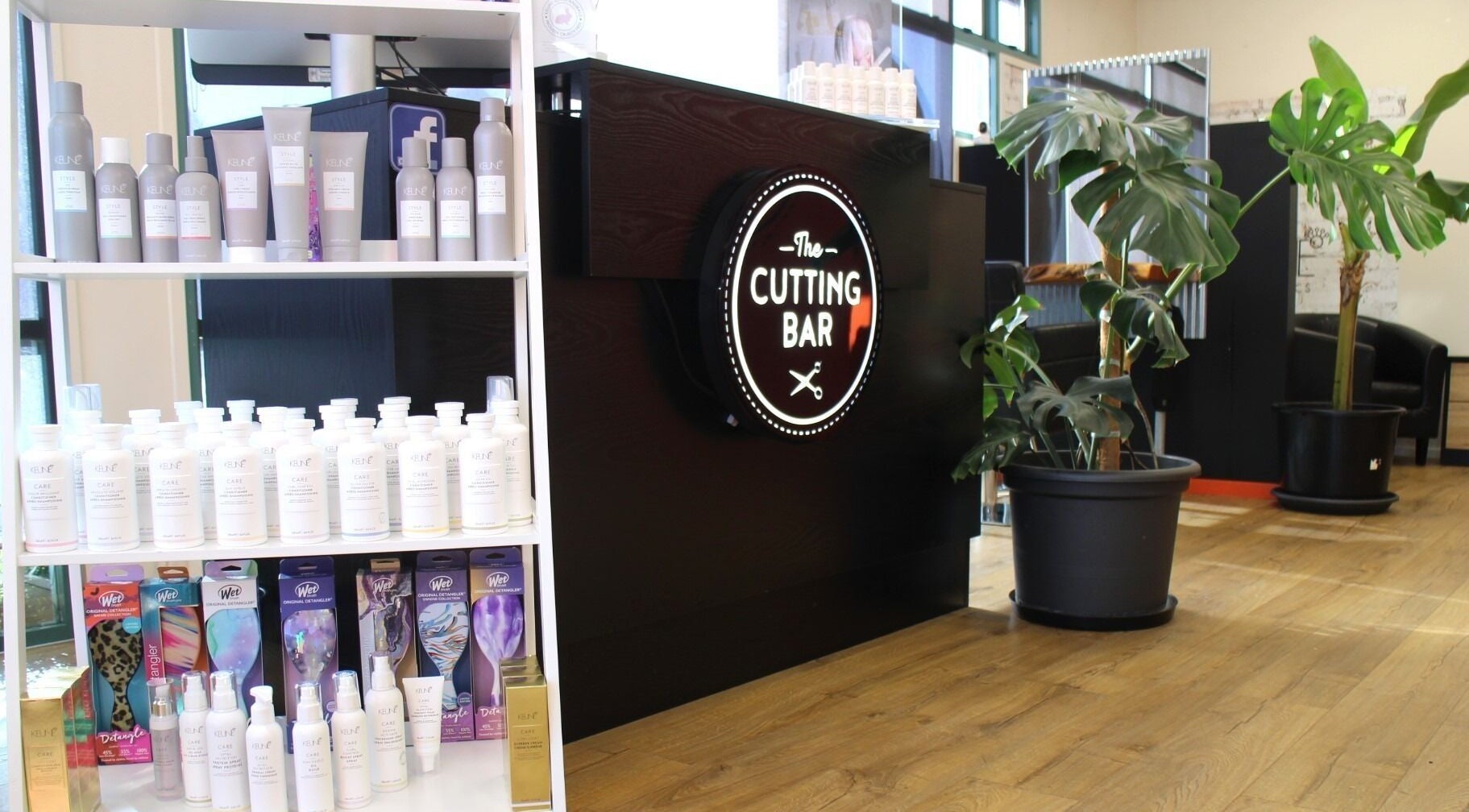 Inside The Cutting Bar, Nelson, NZ, featuring stylish product display and modern decor.