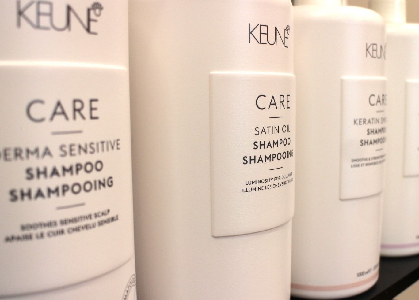 Close-up of premium shampoos at The Cutting Bar, Nelson, Nelson, NZ, highlighting quality hair care.