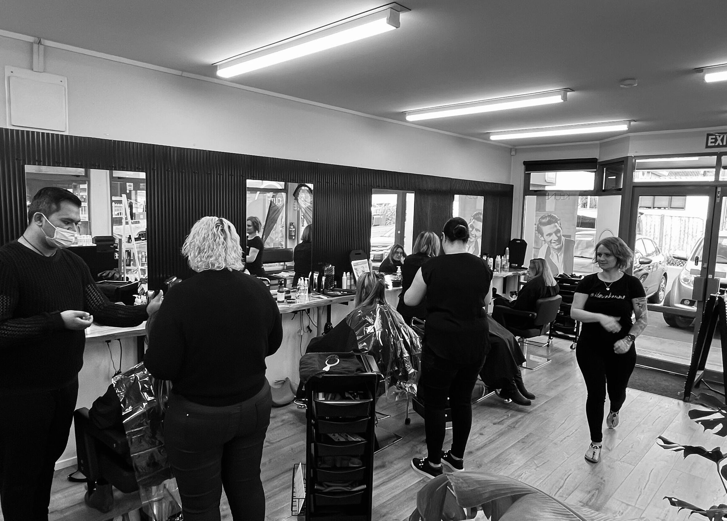 Stylists at work in The Cutting Bar, a vibrant salon in Nelson, Nelson, NZ offering premium beauty services.