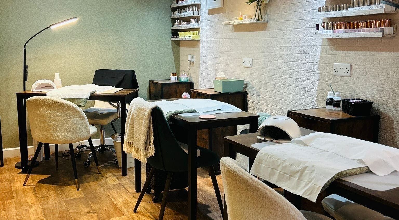 Relaxing treatment space at Chapel Beauty By Lucia, Harrogate, England, GB with cozy chairs and wooden decor.