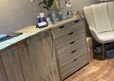 Chapel Beauty By Lucia reception area in Harrogate, England, GB with wooden decor and cozy seating.