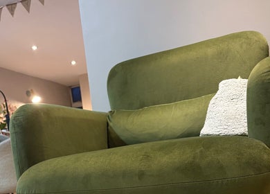 Modern green armchair offers comfort at Chapel Beauty By Lucia in Harrogate, England, GB.