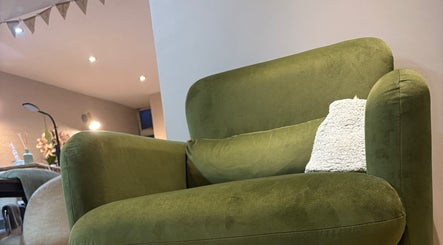 Modern green armchair offers comfort at Chapel Beauty By Lucia in Harrogate, England, GB.