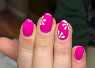 Bright pink nails with daisy designs at Chapel Beauty By Lucia in Harrogate, England, GB.