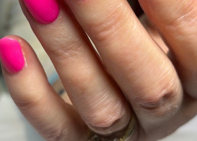 Bright pink manicure at Chapel Beauty By Lucia in Harrogate, England, GB, showcasing vibrant nail art.