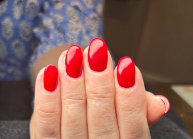 Vibrant red manicured nails showcasing precision at Chapel Beauty By Lucia, Harrogate, England, GB.
