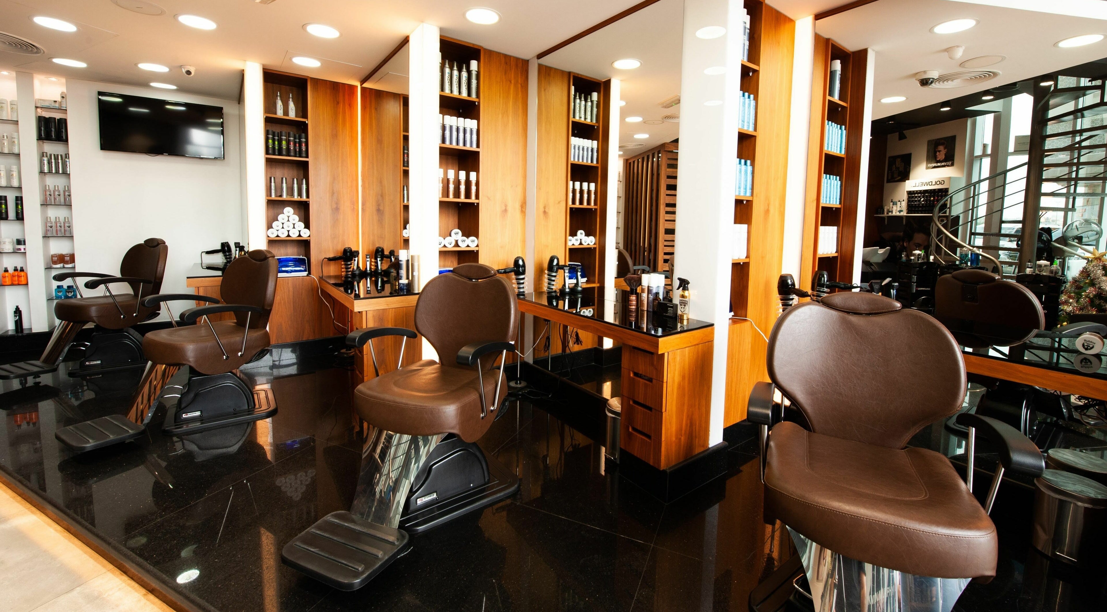 Elegant interior of Byblos Hairdressing Salon, Sharjah, Sharjah, AE showcasing plush styling chairs and sleek decor.