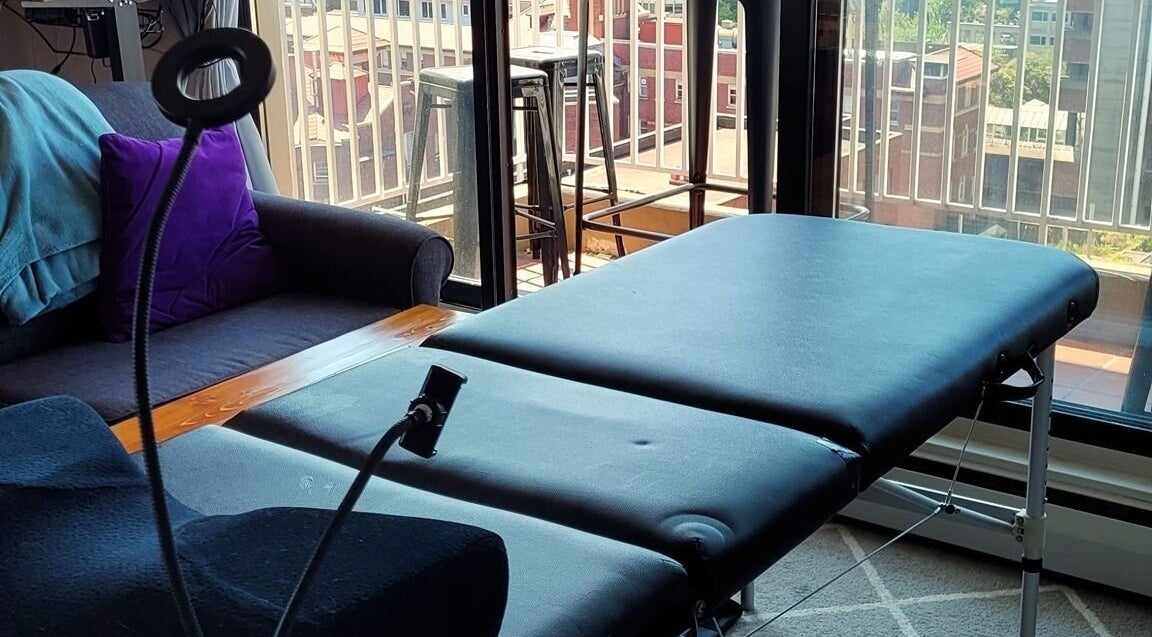 Relaxing mobile lash station setup at Eye Love Lashes YVR in Vancouver, British Columbia, CA with cityscape view.