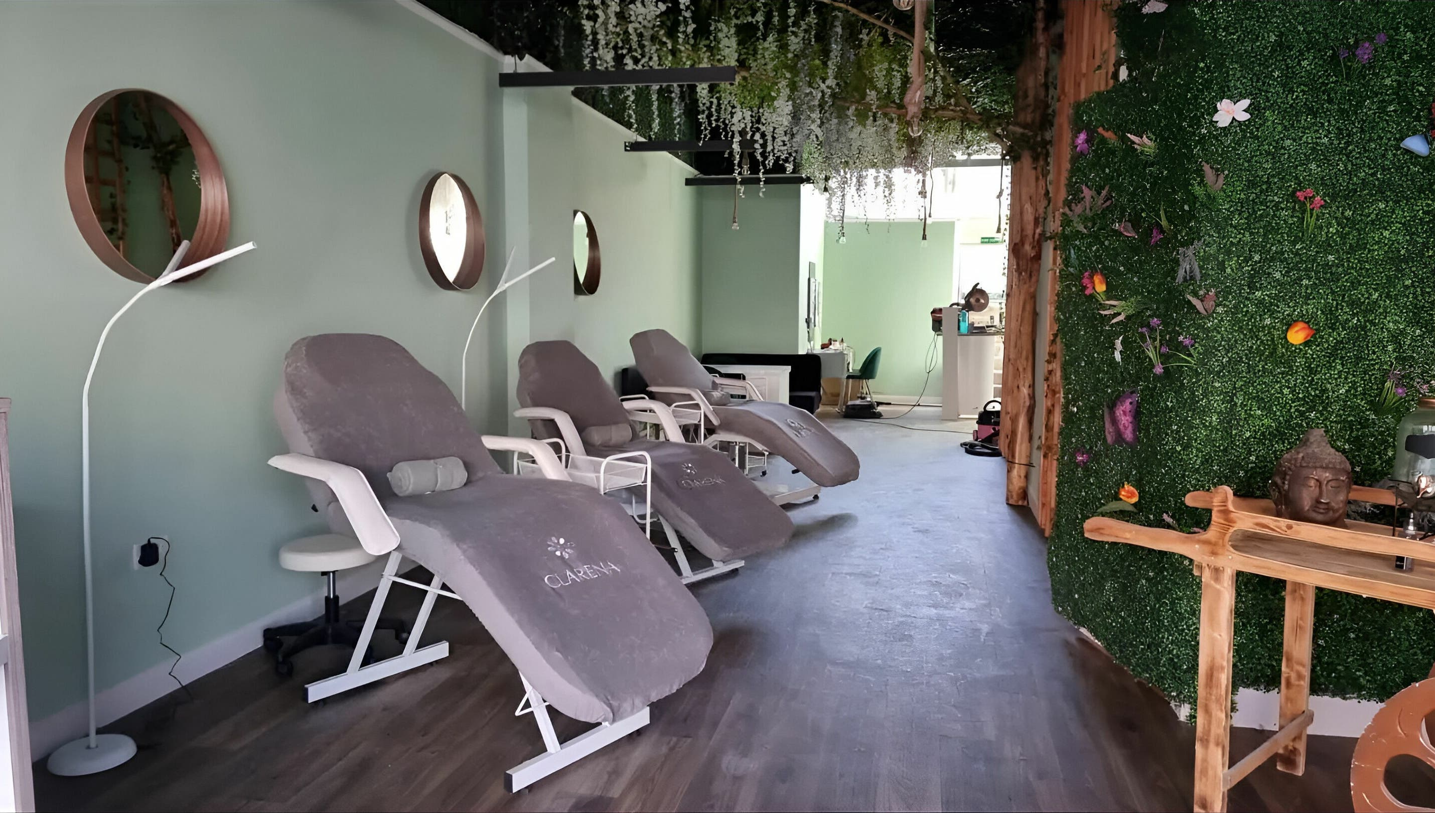 Relaxing lounge at Zen Lashes And Beauty in Nottingham, England, GB, featuring plush chairs and lush decor.