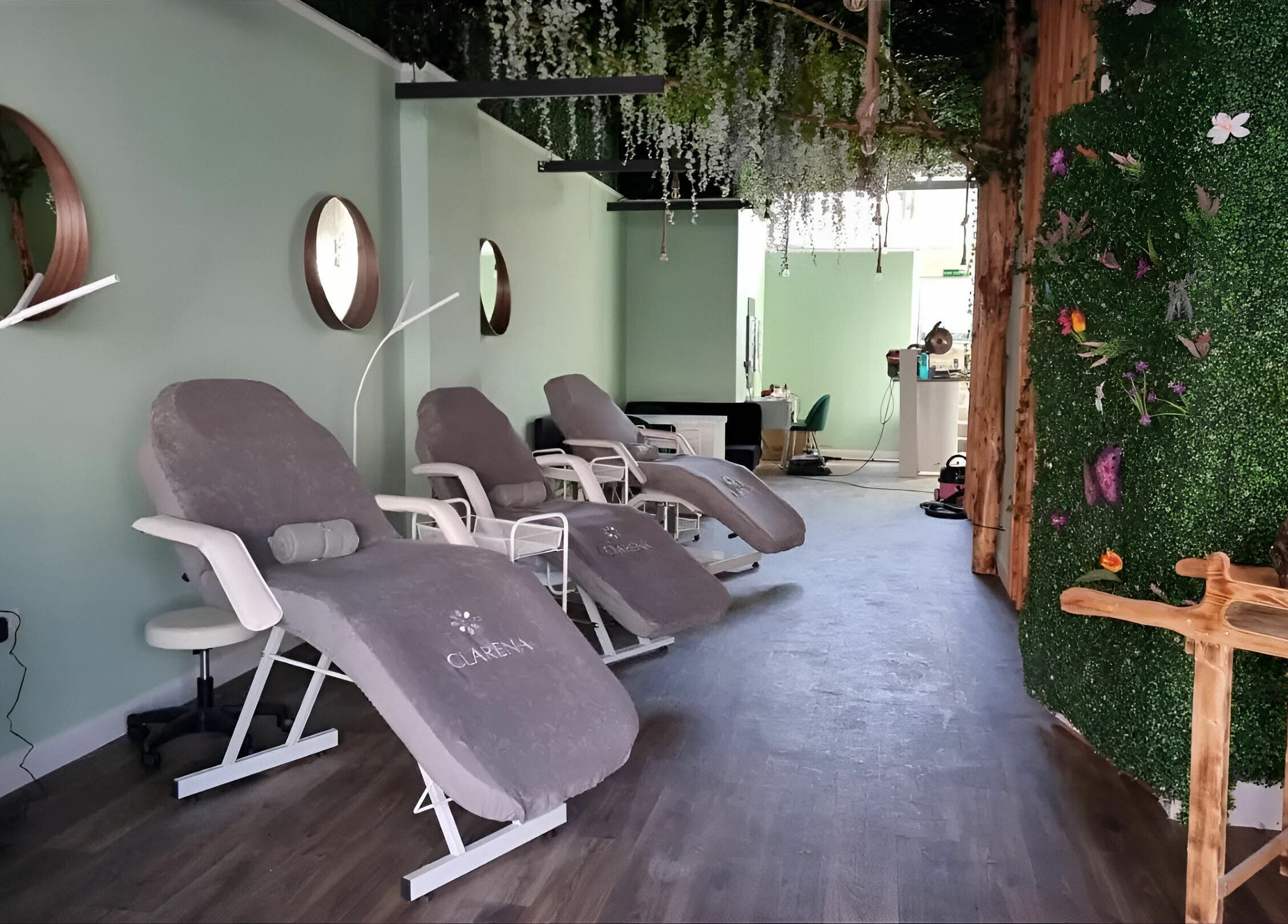 Relaxing lounge at Zen Lashes And Beauty in Nottingham, England, GB, featuring plush chairs and lush decor.