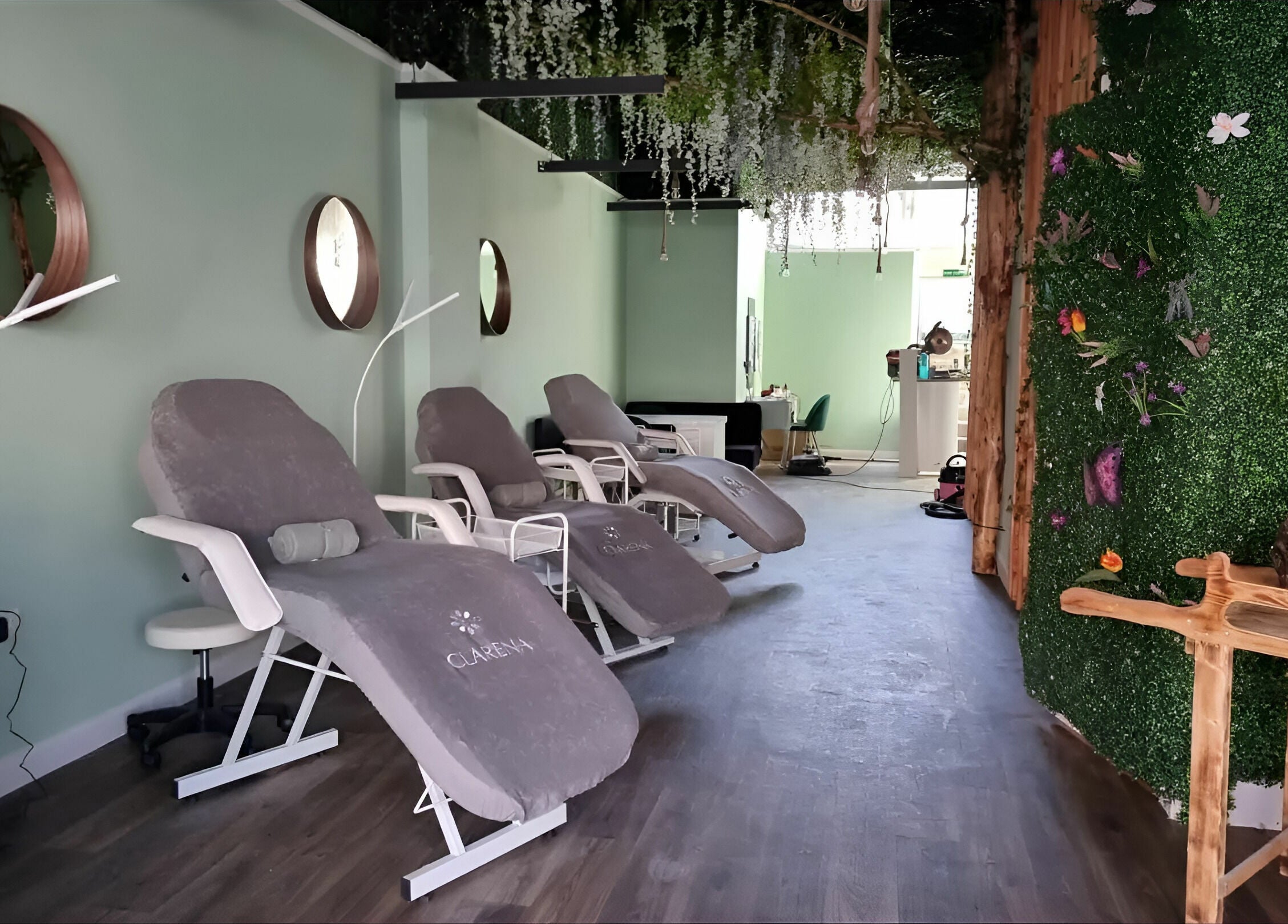 Relaxing lounge at Zen Lashes And Beauty in Nottingham, England, GB, featuring plush chairs and lush decor.