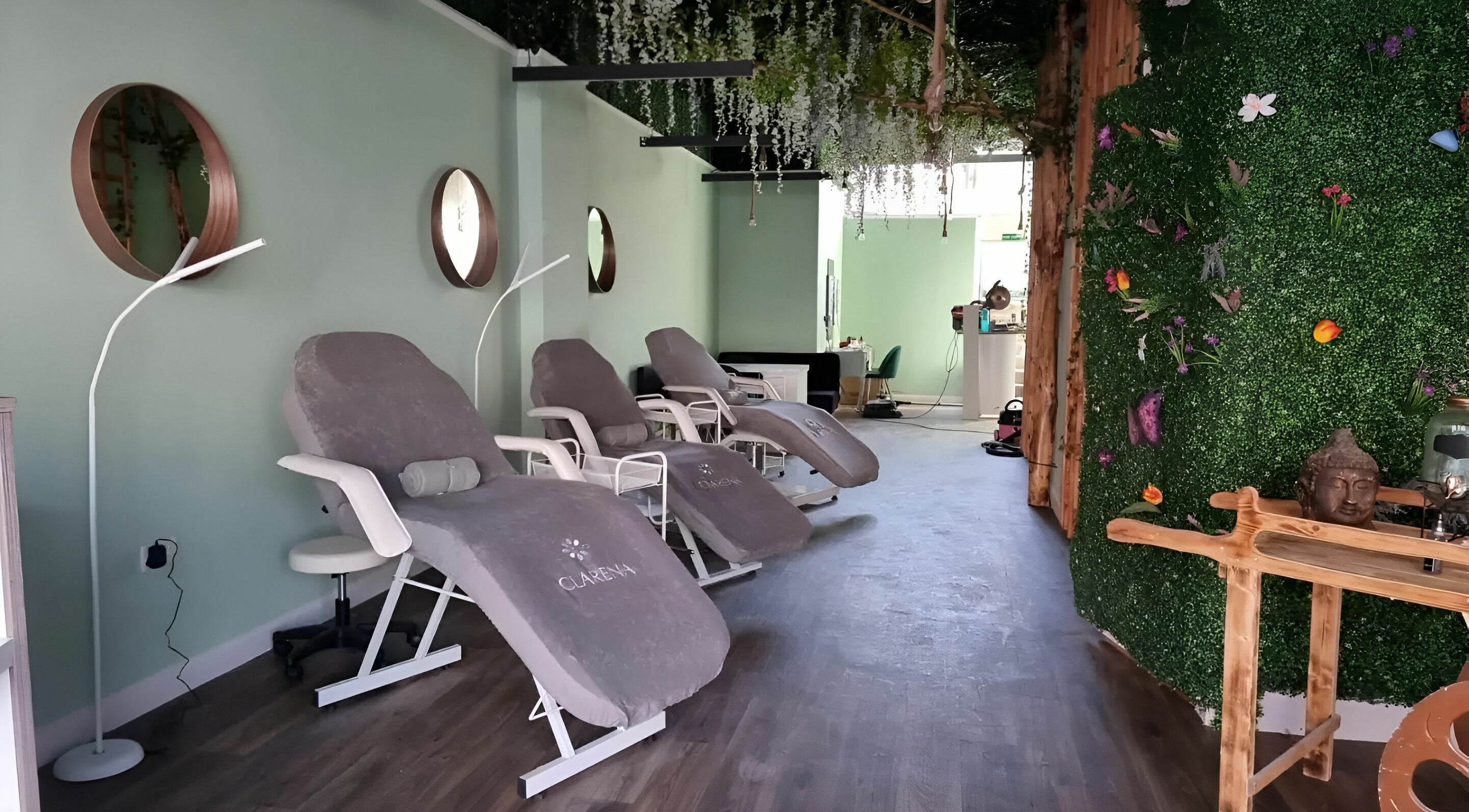 Relaxing lounge at Zen Lashes And Beauty in Nottingham, England, GB, featuring plush chairs and lush decor.