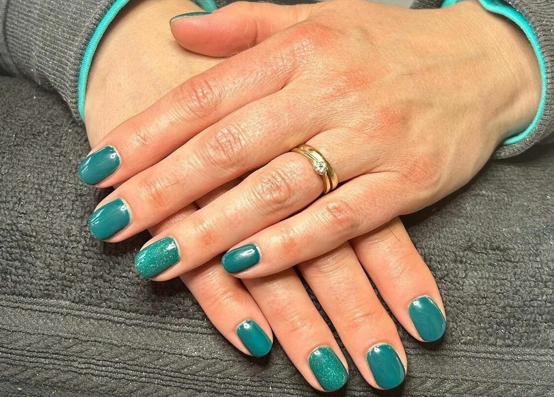 Emerald green manicure at Zen Lashes And Beauty, Nottingham, England, GB, showcasing elegant hand care.