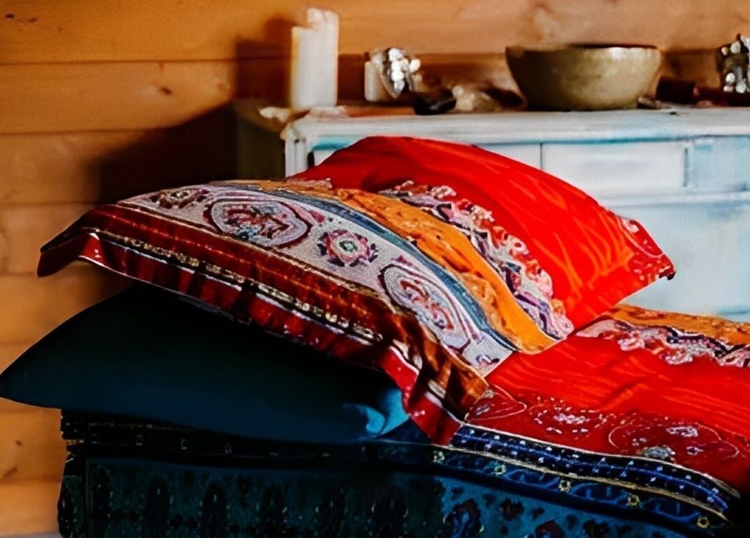 Vibrant cushions on a wooden bench at Touching Lives, Hampton, England, GB. Perfect for relaxation.
