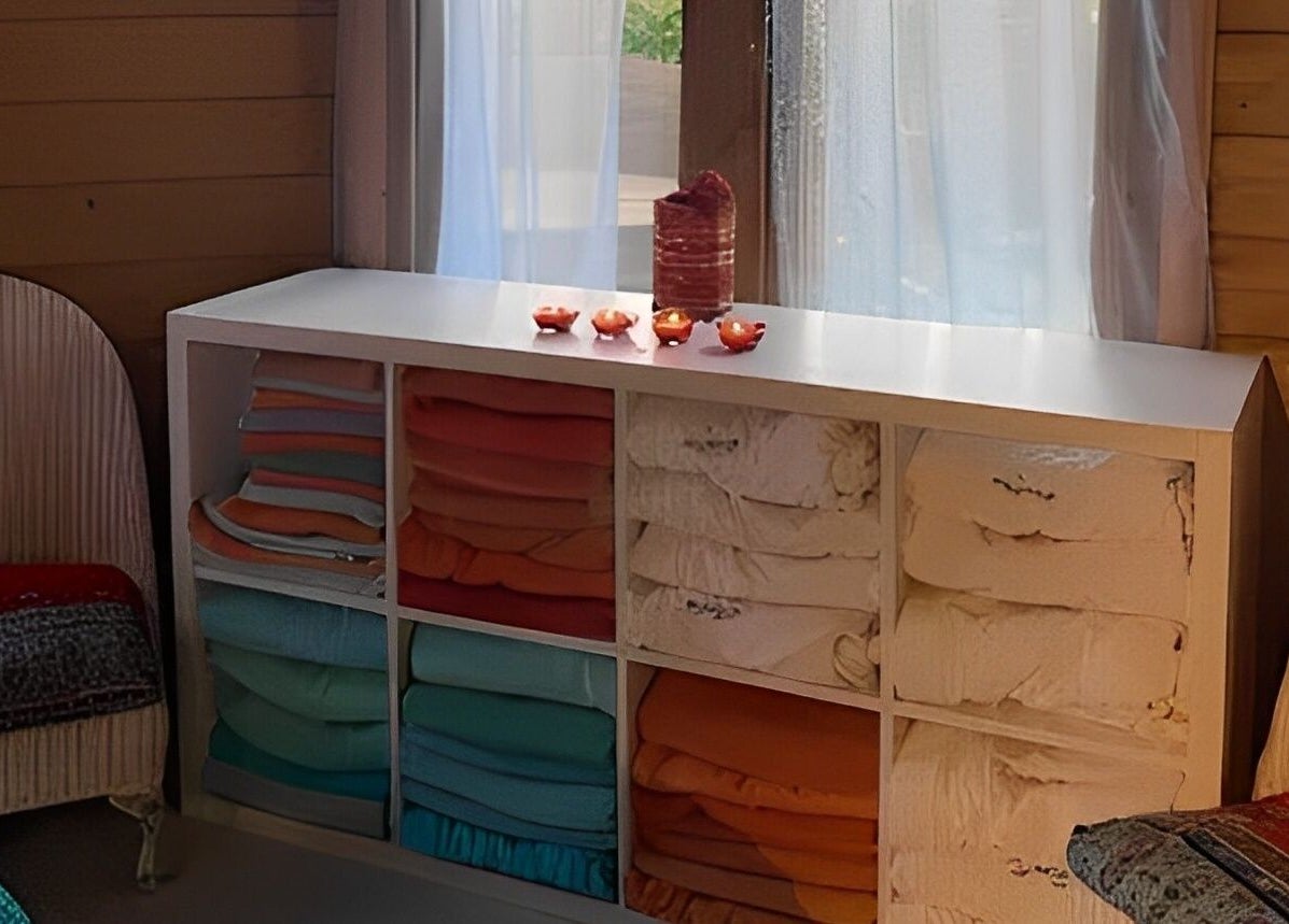 Restful spa corner with folded towels at Touching Lives, Hampton, England, GB.