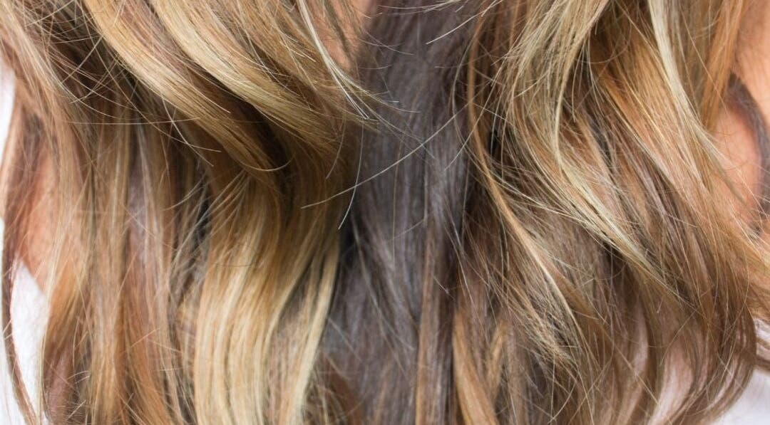 Elegant wavy blonde hair at iSO Spray Tan Hair Beauty, Melbourne, Victoria, AU.