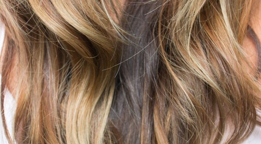 Elegant wavy blonde hair at iSO Spray Tan Hair Beauty, Melbourne, Victoria, AU.