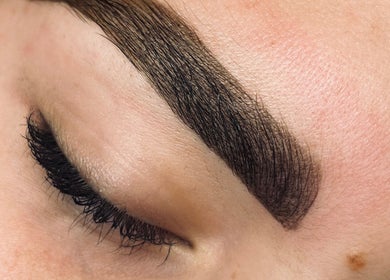 Close-up of expertly groomed brows and lashes at The Lash Lady, Pretoria, Gauteng, ZA.