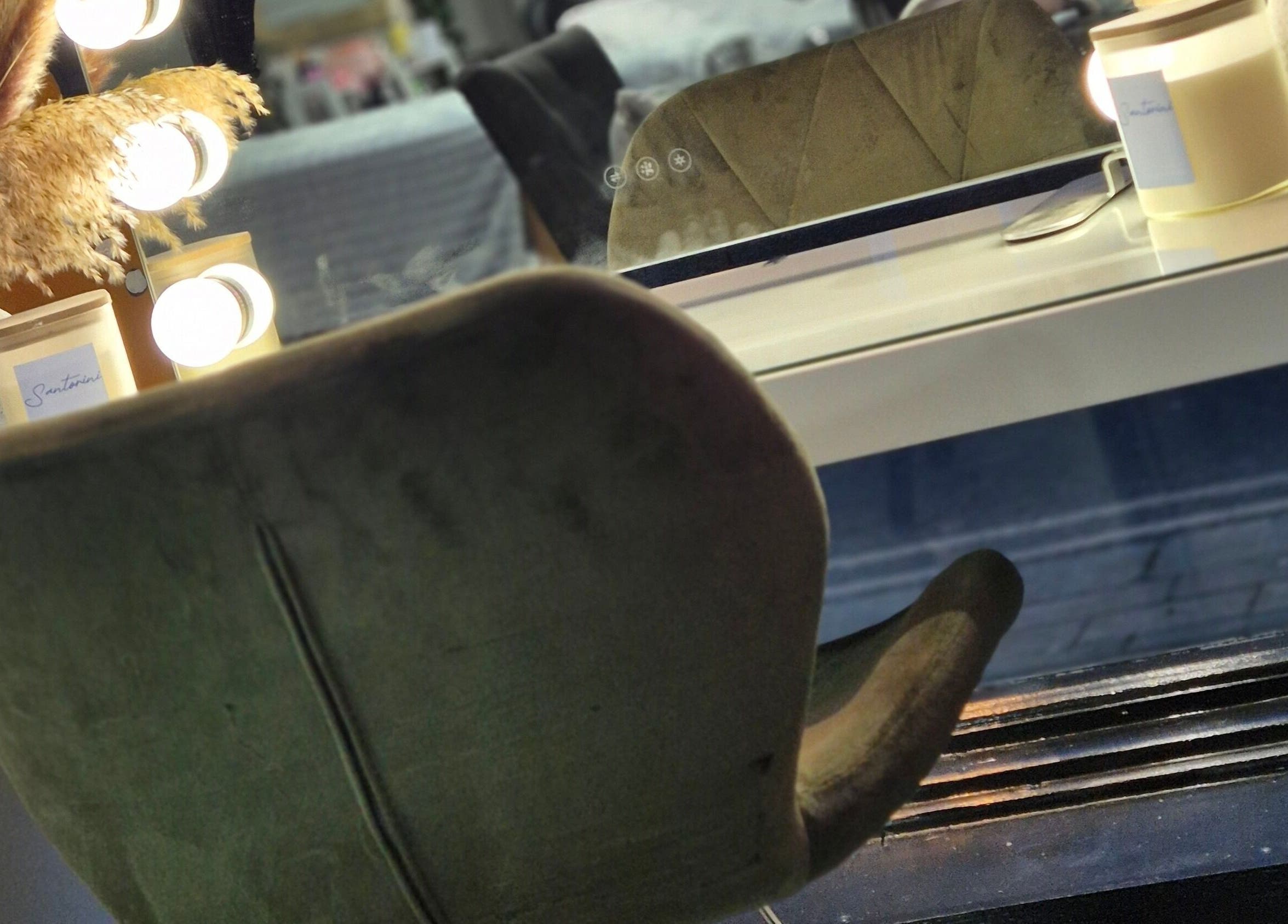 Glamorous vanity setup at Desired Beauty, St Helens, England, GB, featuring plush chair and stylish decor.