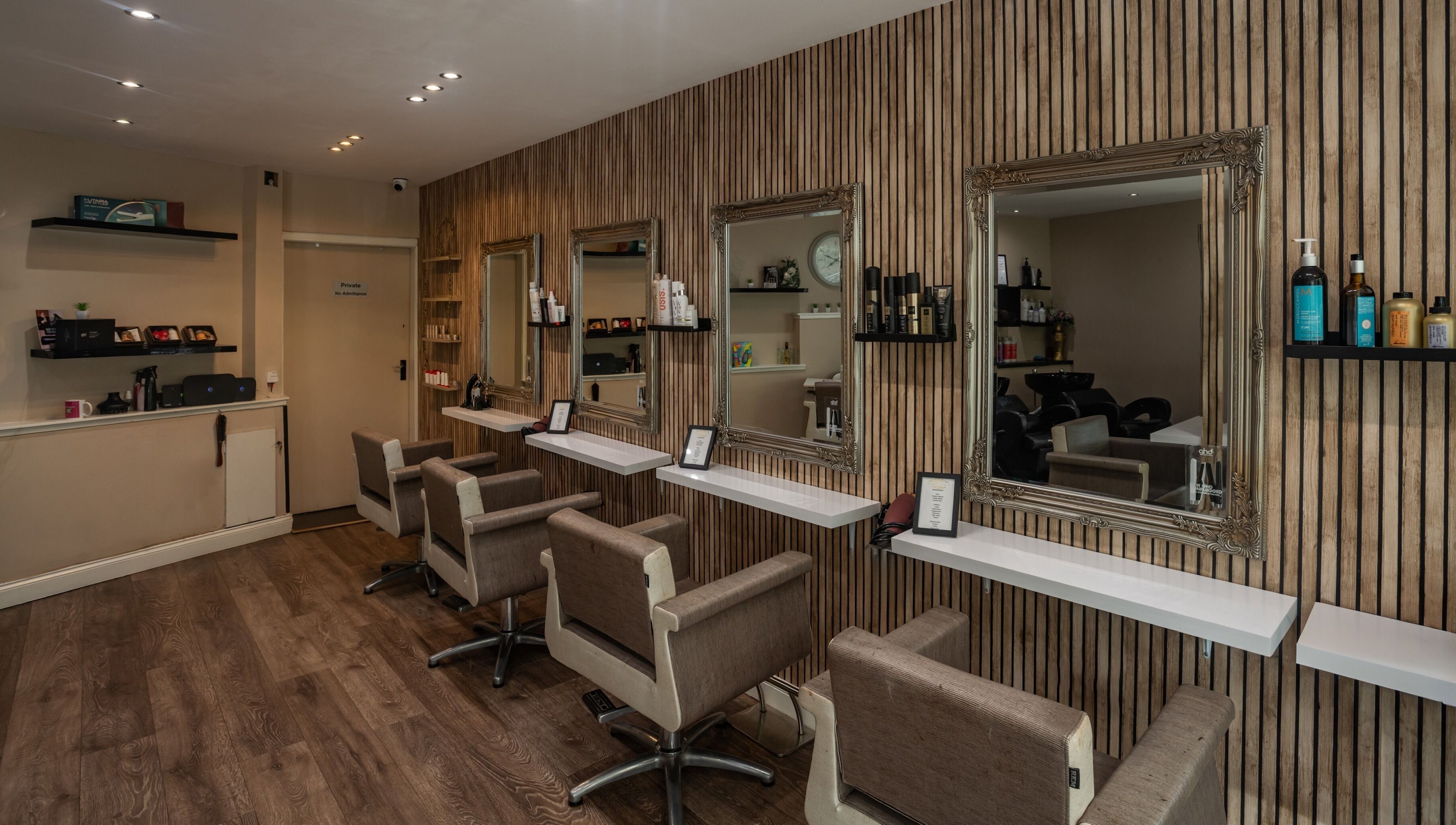 Sophisticated salon chairs facing mirrors at Salon at No.1 in Glasgow, Scotland, GB, showcasing elegant design.