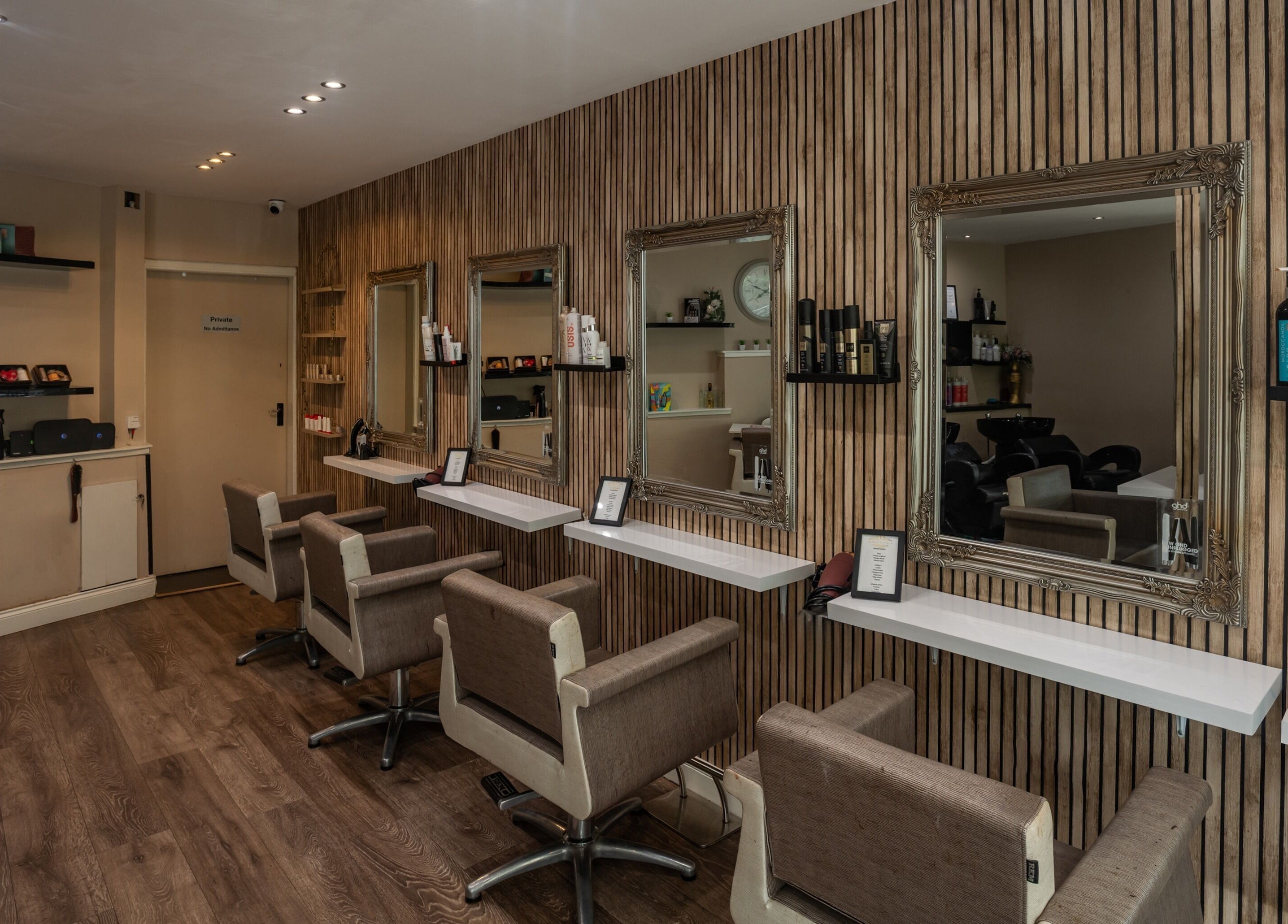Sophisticated salon chairs facing mirrors at Salon at No.1 in Glasgow, Scotland, GB, showcasing elegant design.