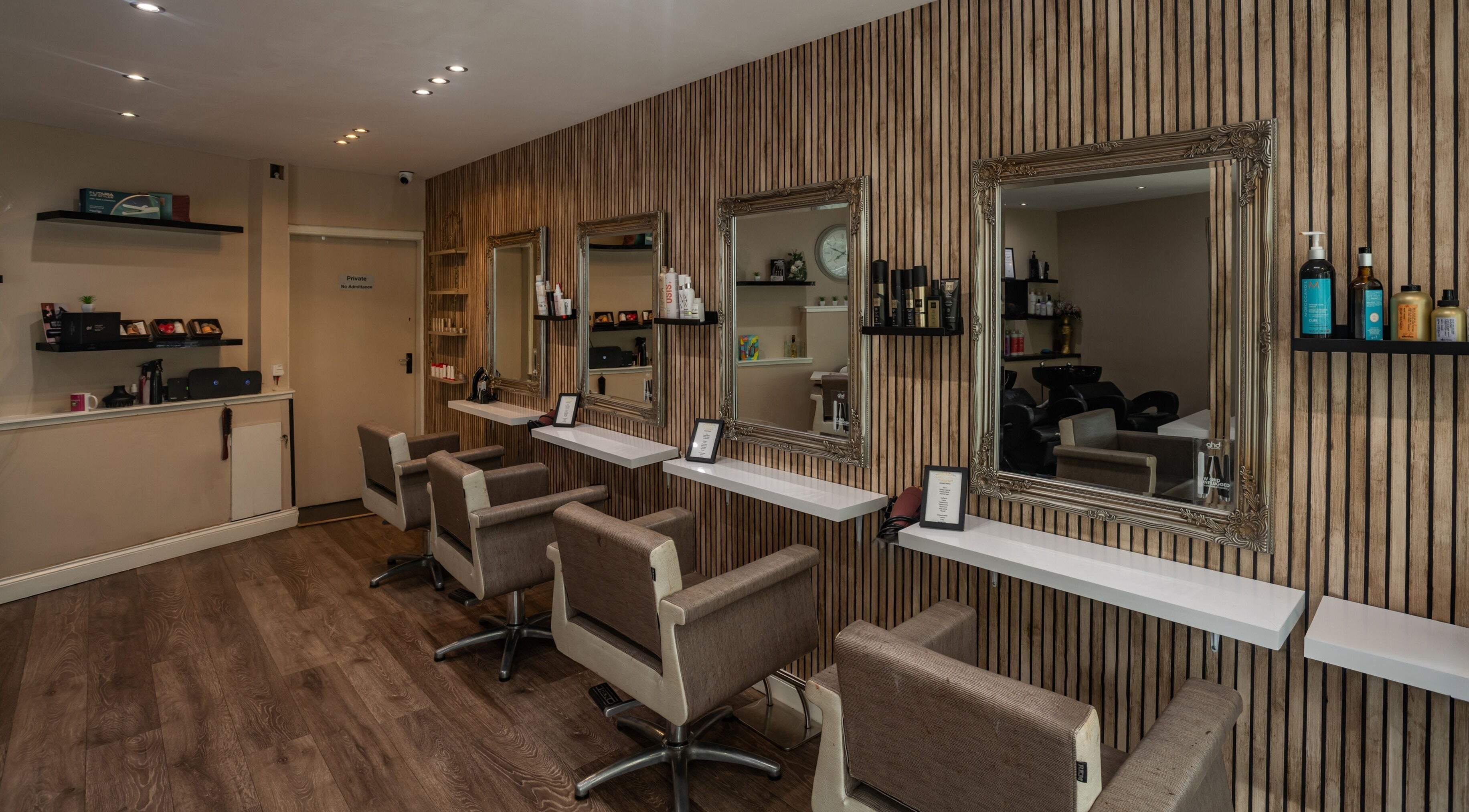 Sophisticated salon chairs facing mirrors at Salon at No.1 in Glasgow, Scotland, GB, showcasing elegant design.
