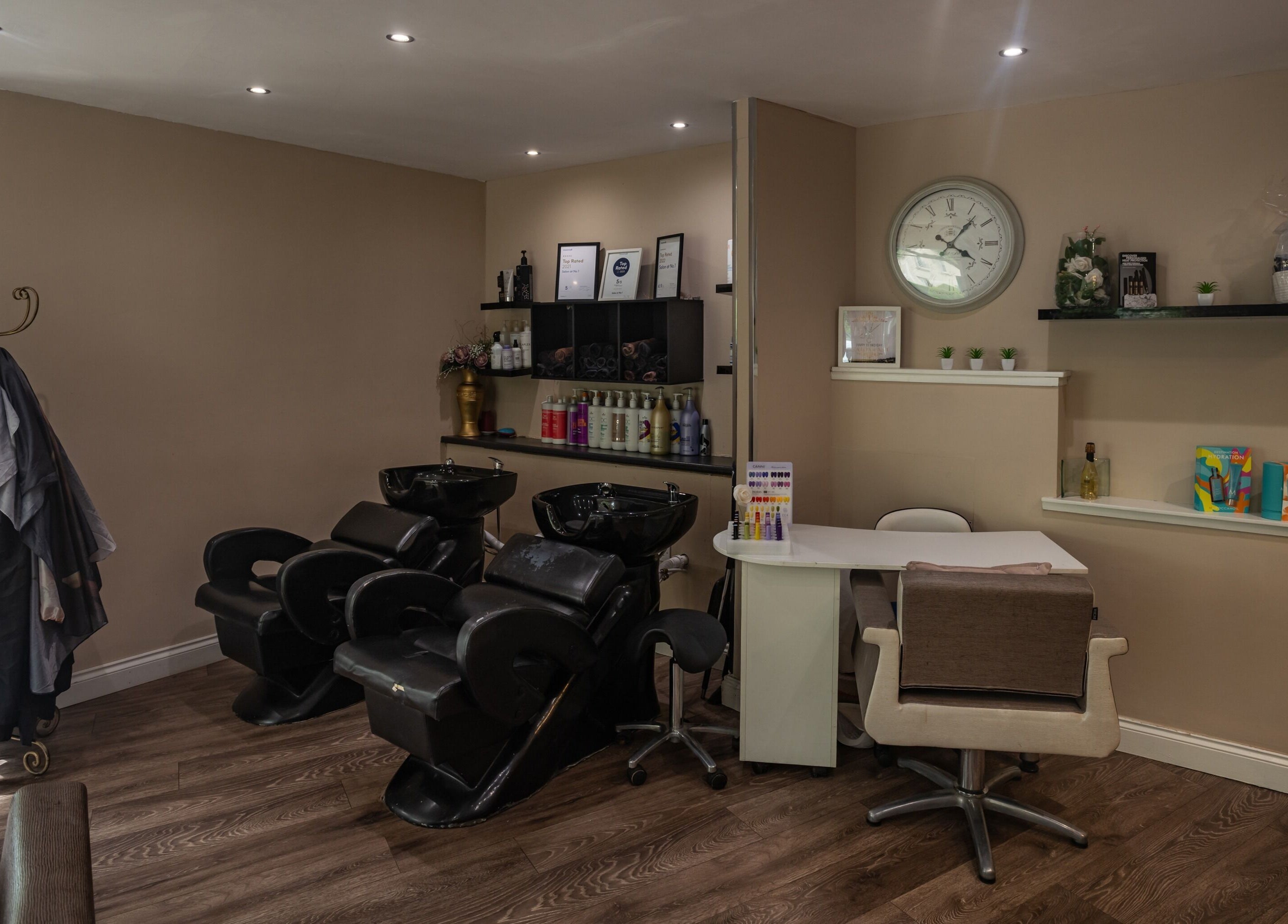 Modern salon chairs and wash stations at Salon at No.1, Glasgow, Scotland, GB, offering premium wellness services.